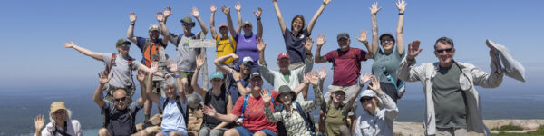 Volunteers pose for a photo on the summit of Sargent Mountain during a soil restoration hike on June 26, 2024 at Sargent Mountain in Mount Desert Island, M.E.