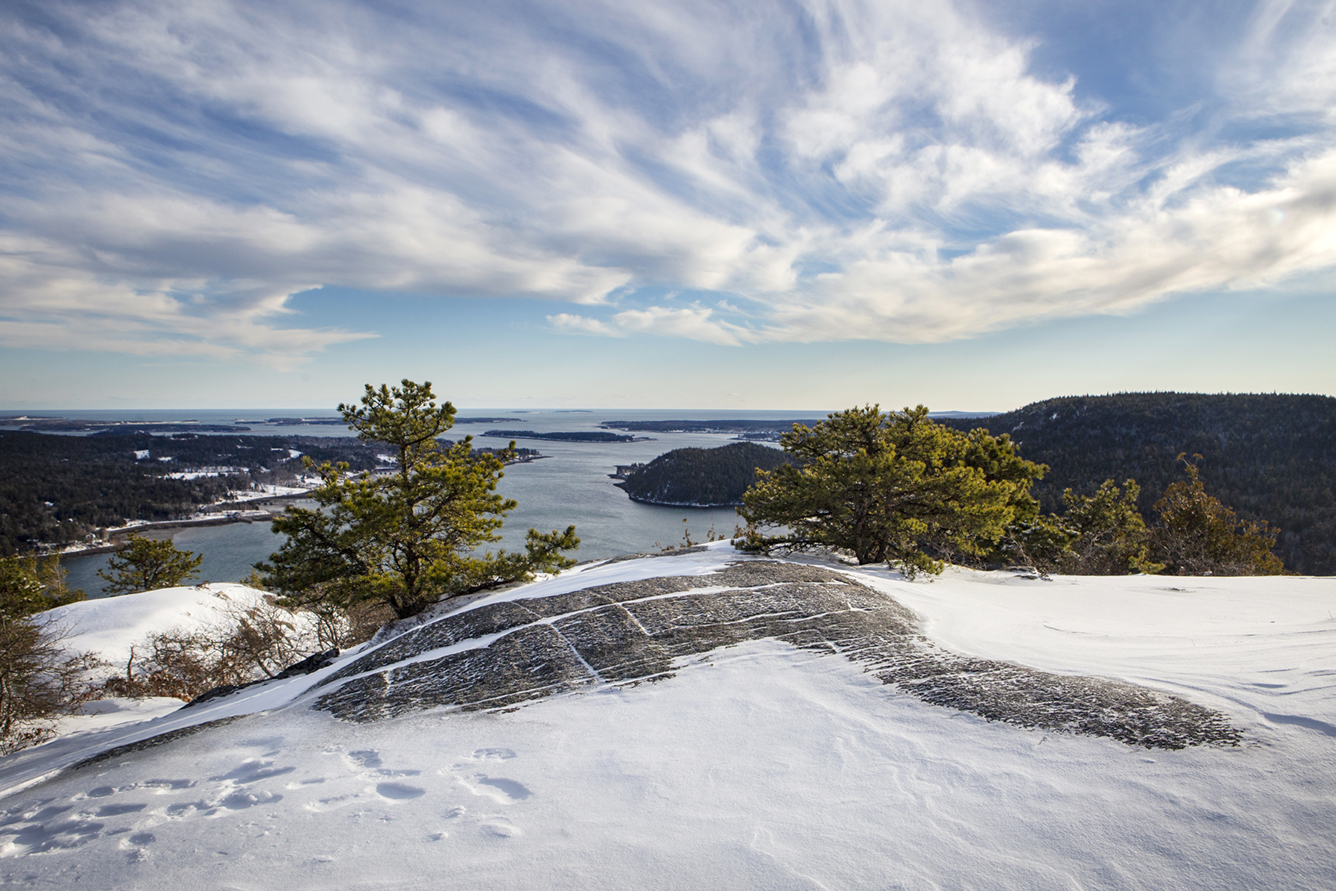 Snow covers Acadia Mountain in Acadia National Park