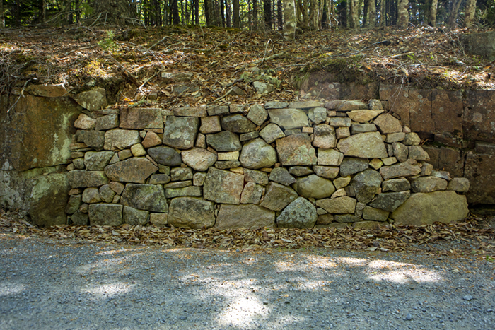 A rebuild dry-laid stone masonry retaining wall is seen during a project to rehabilitate the carriage road while preserving its historic character around Eagle Lake in Acadia National Park.