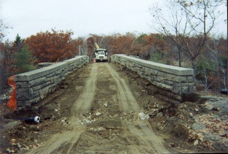 A MacQuinn Construction dump truck moves across the Duck Brook Bridge while that section of the Acadia National Park carriage roads was being rehabilitated during the 1990s.