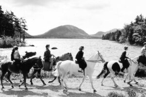 Visitors ride horses on the north side of Eagle Lake in 1958. Please note horseback riding is no longer permitted on this section of carriage road.