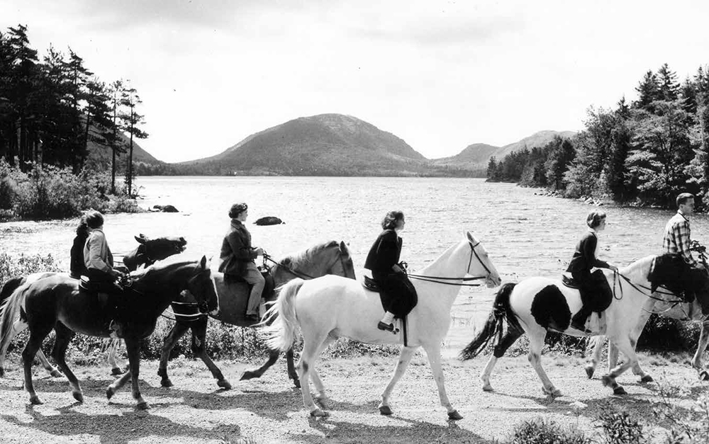 Visitors ride horses on the north side of Eagle Lake in 1958. Please note horseback riding is no longer permitted on this section of carriage road.